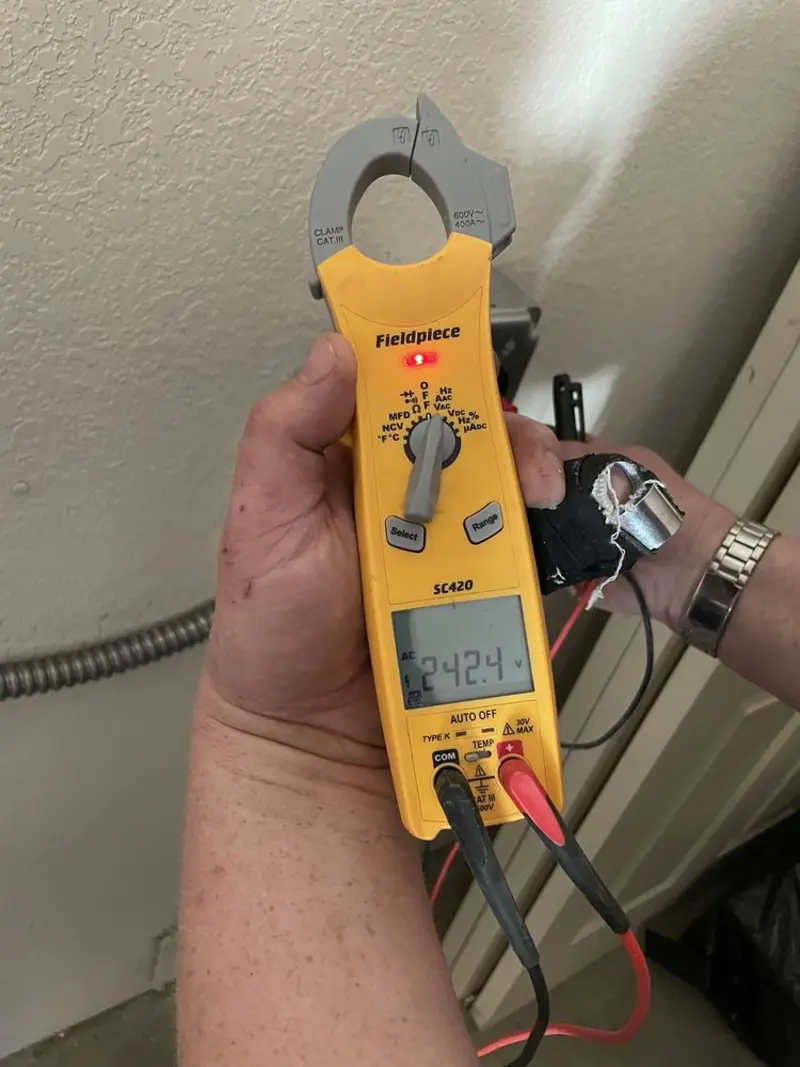 Voltage testing with clamp meter during Recessed Lighting Installation in South Londonderry